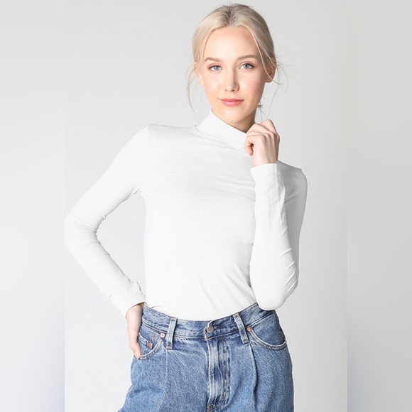 seamless top featuring a turtleneck and long sleeves - Picture 1 of 3